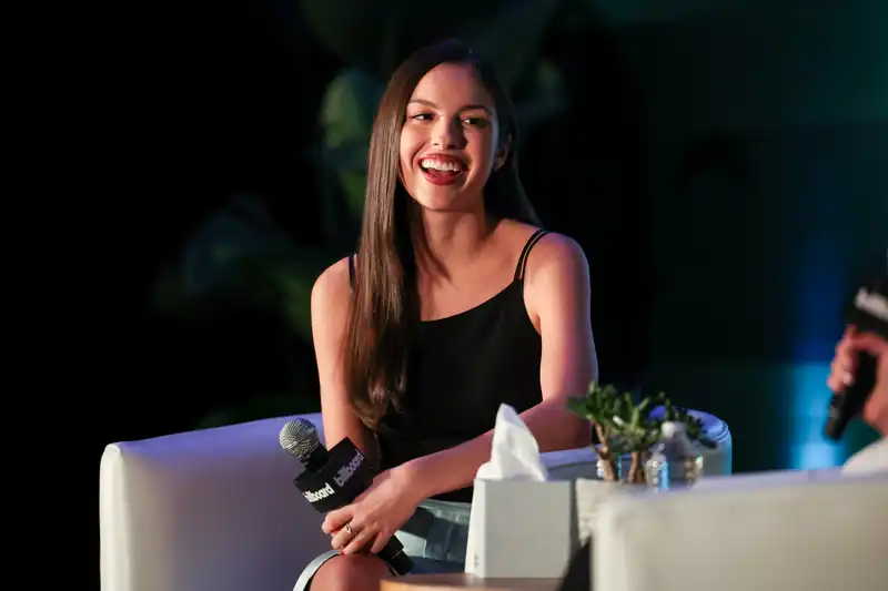 Olivia Rodrigo lets her Y2K Gucci thong and pencil skirt talk at the Billboard Live Music Summit