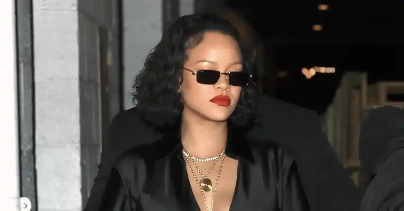 Rihanna unleashes her inner Millennial in skintight leggings and satin out-of-the-way top