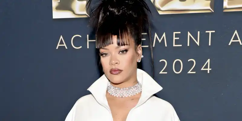 Rihanna matches her custom Alaïa dress with her signature white pedicure