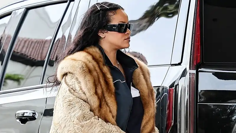 Rihanna elevates her designer Crocs clogs with a giant fur coat.