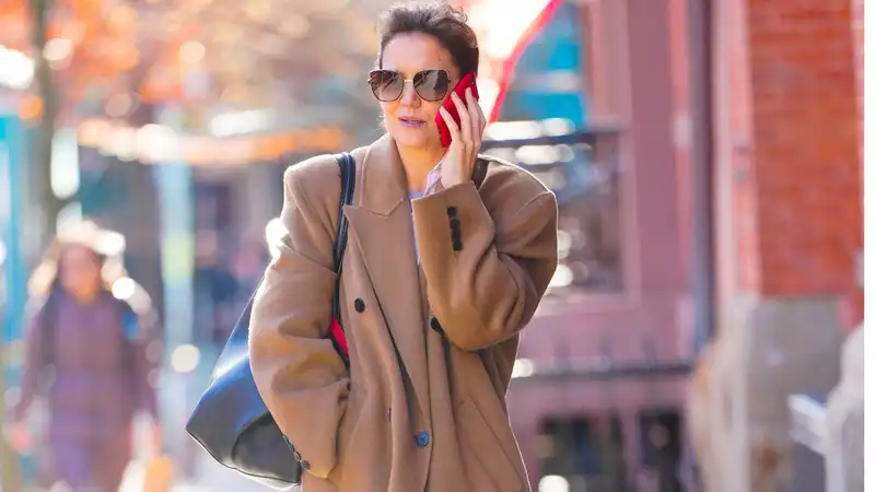 Katie Holmes and her favorite $495 coat celebrated its second anniversary.