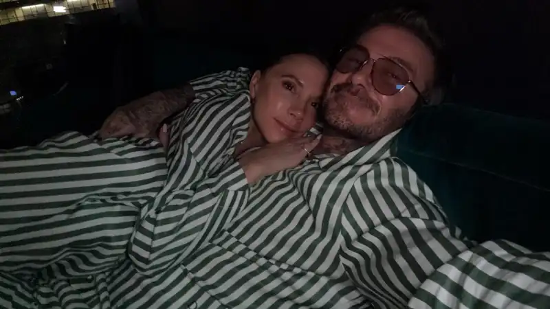 Victoria and David Beckham, twin shots in matching Christmas PJs.