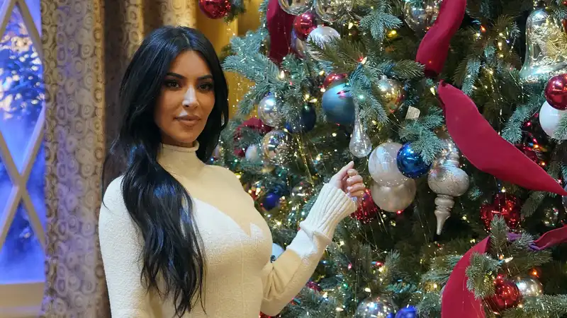 Kim Kardashian Recreates Iconic “Breaks the Internet” Photo at Skims Christmas Party